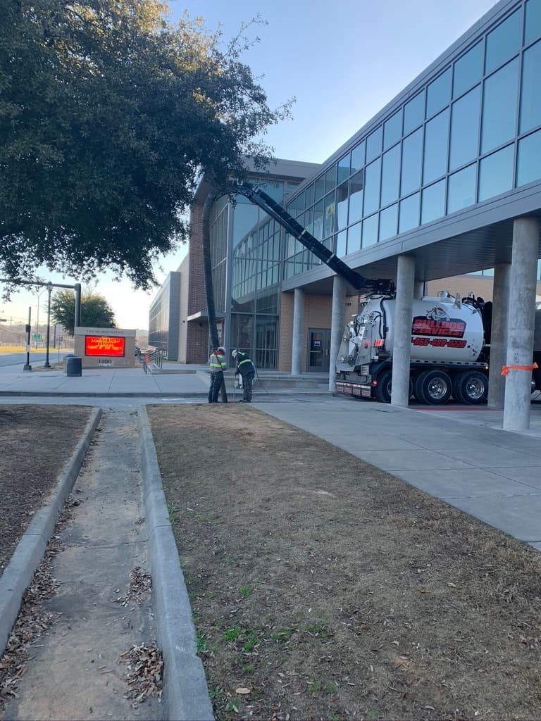 1-A Services vac truck at a commercial job site